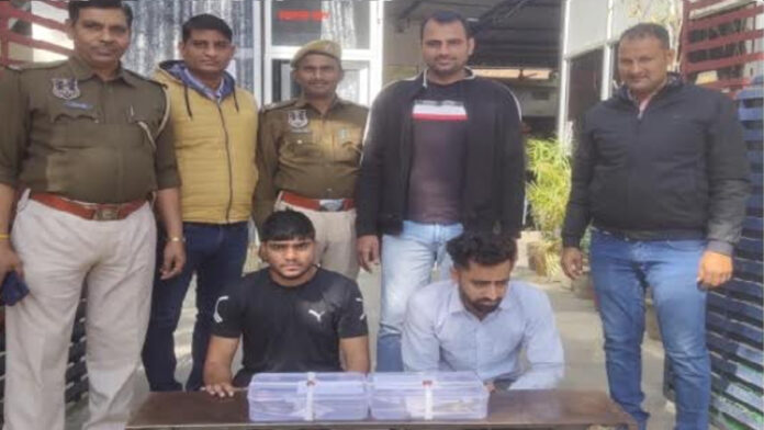 Two miscreants along with two country-made pistols were caught by the police.